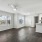 spacious living room, dining area, and living space with ample natural light and a ceiling fan at Briarhill Atlanta apartments in Atlanta, GA