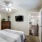 ceiling fan and light fixture in bedroom with private bathroom at Briarhill Atlanta apartments in Atlanta, GA